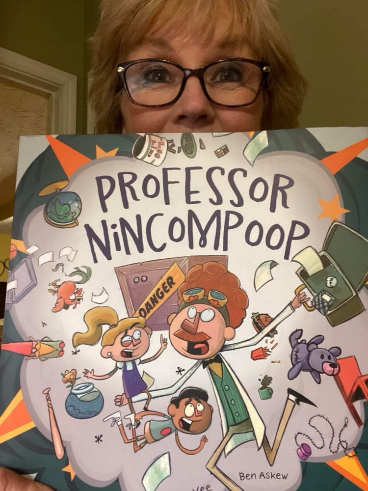 A young reader with one of the books